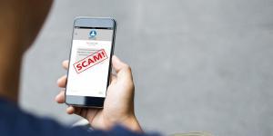 phone displaying scam notification